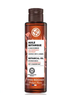 Beyaz bir zeminde dik duran, pembe çiçek desenli beyaz etiketinde Fransızca ve İngilizce Huile Botanique, Botanical Oil ve Dry & Damaged Hair yazıları olan, 100 ml kahverengi bir Yves Rocher saç bakım yağı şişesi, yıpranmış saç problemlerine etkili bir çözüm sunuyor.