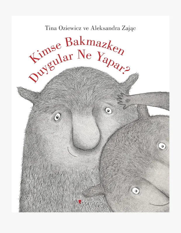 Kimse Bakmazken Duygular Ne Yapar? başlıklı çocuk kitabının kapağında, sevimli, tüylü ve büyük gözlü iki fantastik karakter, arka plandan uzanan bir elin büyük olanın kulağını kaşımasıyla etkileşim halinde gülümserken, bu görsel çocukların duygusal gelişimini ve hayal dünyasını zenginleştiren doğru kitap seçimi konusundaki yazımızla mükemmel bir uyum sergiliyor.