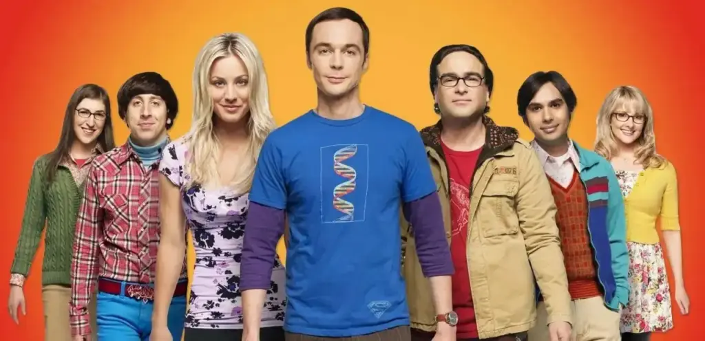 The Big Bang Theory dizisinin ana karakterleri renkli bir arka plan önünde yan yana dizilmiş, ortada Sheldon Cooper yer alıyor.