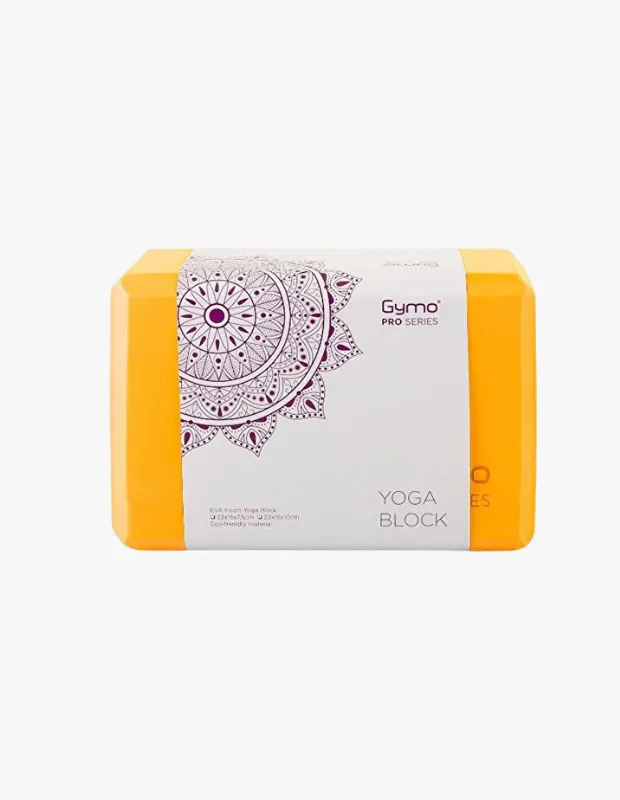 Parlak turuncu renkte, köşeleri yuvarlatılmış ve üzerinde mor mandala desenli beyaz bir etiket taşıyan bu Gymo PRO SERIES YOGA BLOCK, İstanbul'un en iyi yoga stüdyolarında yoga pratiklerini desteklemek ve derinleştirmek için kullanılan temel bir yardımcı ekipman olarak, bedensel ve zihinsel yolculukta denge ve konfor sunuyor.