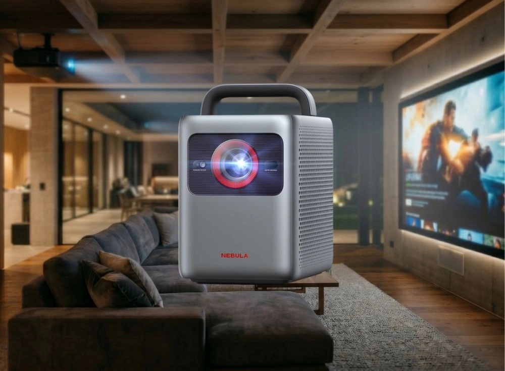 Anker Nebula Cosmos Laser 4K SE akıllı projeksiyon cihazı, lensinden yayılan parlak mavi ışıkla modern bir ev sineması ortamında koyu renkli bir kanepenin önündeki sehpanın üzerinde konumlanmış, sağda büyük ekranda hareketli bir film sahnesi yansıtılırken lazer teknolojisinin üstün görüntü kalitesini vurguluyor.