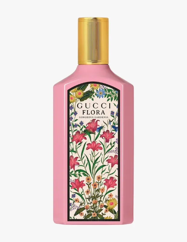 Altın renkli, yivli kapağı ve pembe dikdörtgen şişesi üzerinde canlı kırmızı, sarı ve mavi tonlarda çiçeklerle bezenmiş, ortasında GUCCI FLORA GORGEOUS GARDENIA yazan detaylı bir etiket bulunan göz alıcı bir gelin parfümleri