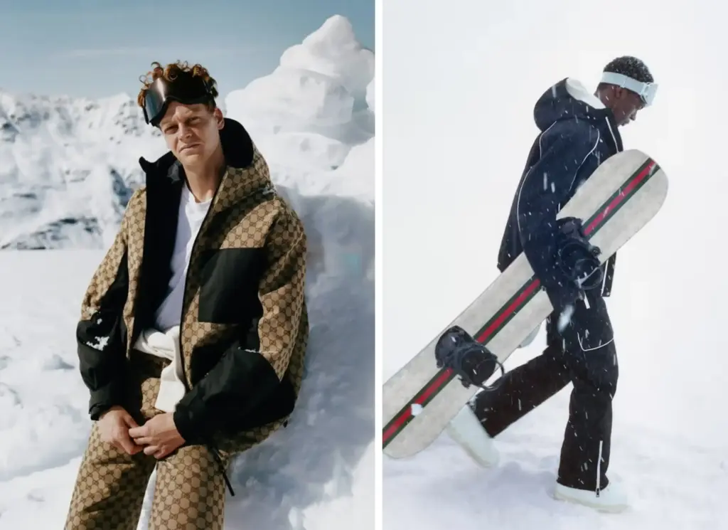 Gucci erkek kayak koleksiyonundan Gucci logolu bir kayak ceketi ve kayak pantolonu giyen ve siyah kayak gözlüğü takan bir erkek model ile sol tarafta elinde beyaz Gucci snowboard tutarak yürüyen ve üzerinde siyah kayak montu ve pantolonu olan insan