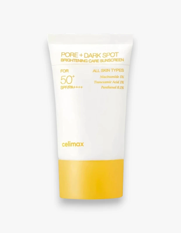 Celimax markasına ait, beyaz gövdeli ve sarı kapaklı tüpteki PORE + DARK SPOT BRIGHTENING CARE SUNSCREEN güneş kremi, Niacinamide %5, Tranexamic Acid %1 ve Panthenol %0.1 içerikleriyle tüm cilt tipleri için gözenek ve koyu leke bakımı sunarken, SPF 50+ korumasıyla öne çıkıyor.