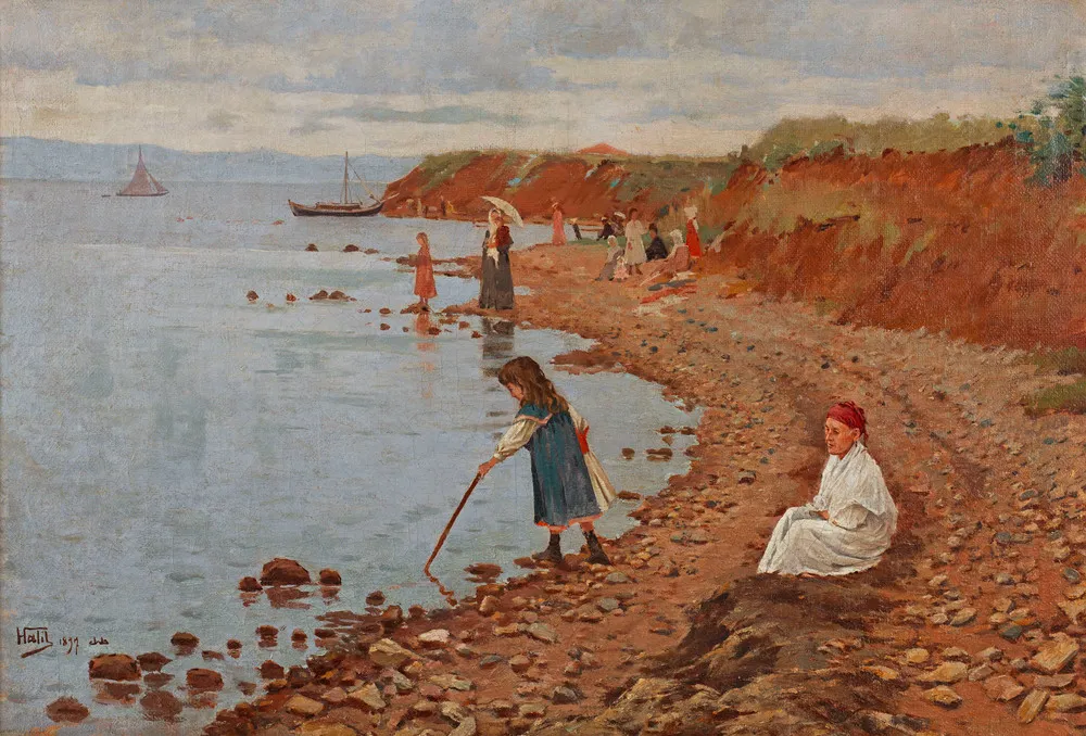 Alt text: Halil Paşa imzalı sahil temalı tabloda kayalık kıyıda yürüyen figürler ve denize çubukla dokunan çocuk, 19. yüzyıl sonu Osmanlı dönemi peyzaj resmi.