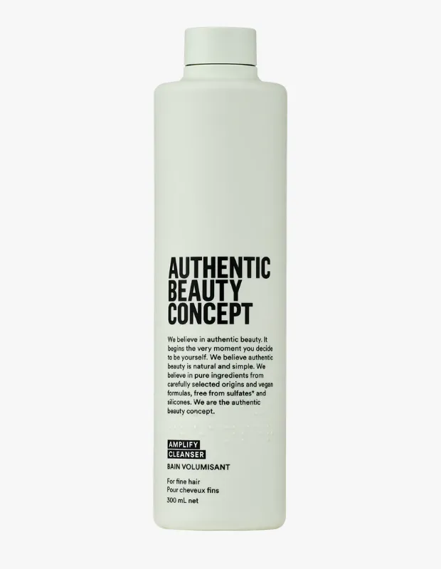 Dikdörtgen formda, soluk yeşil renkli, üzerinde siyah harflerle AUTHENTIC BEAUTY CONCEPT yazan ve hacim veren şampuan olarak etiketlenmiş 300 ml'lik şişenin ön yüzü, sade ve modern tasarımıyla dikkat çekiyor.