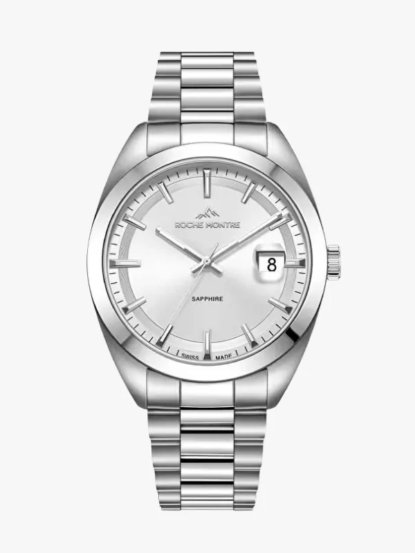 Gelin-damat saatleri konseptine uygun, parlak metal kordonlu ve kasalı, gümüş rengi kadrana sahip, ROCHE MONTRE marka, saat 3 yönünde 8 rakamını gösteren takvim penceresi ve SAPPHIRE camlı olduğu belirtilen, zarif tasarımlı bir kol saati.