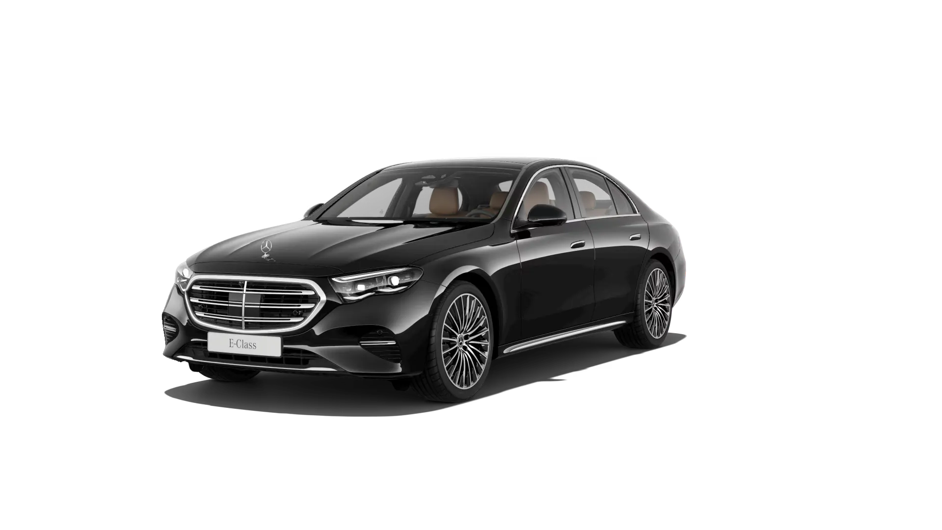 Önden sol çapraz açıyla görünen, parlak siyah renkteki lüks Mercedes-Benz E-Serisi sedan otomobil, açık farları, belirgin krom detaylara sahip ızgarası, bej renkli iç mekanı ve şık çok kollu jantlarıyla göz alıcı bir duruş sergiliyor.
