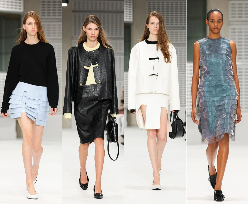 Londra Moda Haftası'nın dikkat çeken anlarından birinde, podyumda özgüvenle yürüyen bir model, parlak spot ışıkları altında Mulberry markasının zarif yeni sezon çantasını ve modern tasarımlı elbisesini sergileyerek defilenin atmosferine canlılık katıyor.