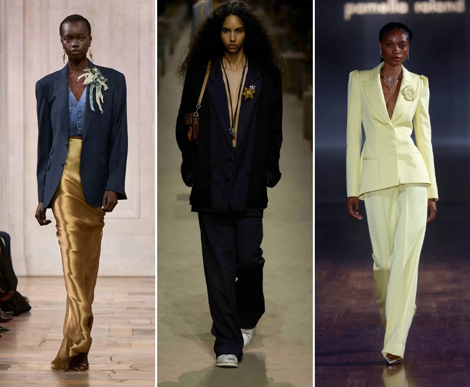 New York Moda Haftası'ndan, bol kesim lacivert blazer ceketini altın rengi etekle kombinleyen bir model, koyu lacivert takım elbisesi ve altın yıldız broşuyla bir başka model ve zarif açık sarı takımıyla çiçek broş kullanan üçüncü bir modelin podyumda sergilediği çeşitli trend broş ve ceket kombinasyonları.