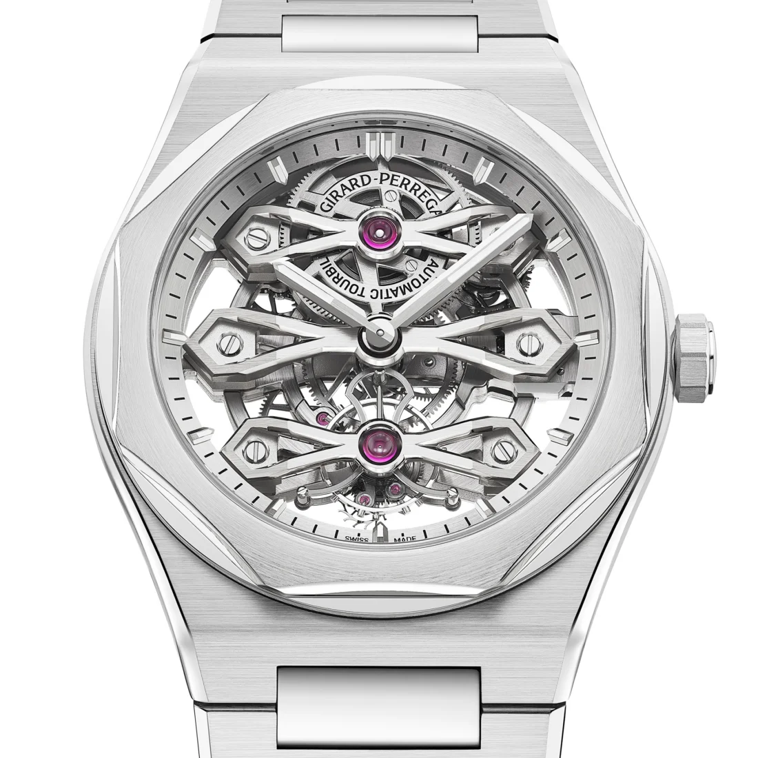 Girard-Perregaux'nun sofistike Laureato Fifty Three Goldbridges iskelet saati, beyaz bir yüzeyde net bir şekilde görünen karmaşık mekanizması ve lüks altın köprüleri ile saatçilik zanaatının estetik ve teknik mükemmelliğini gözler önüne seriyor.