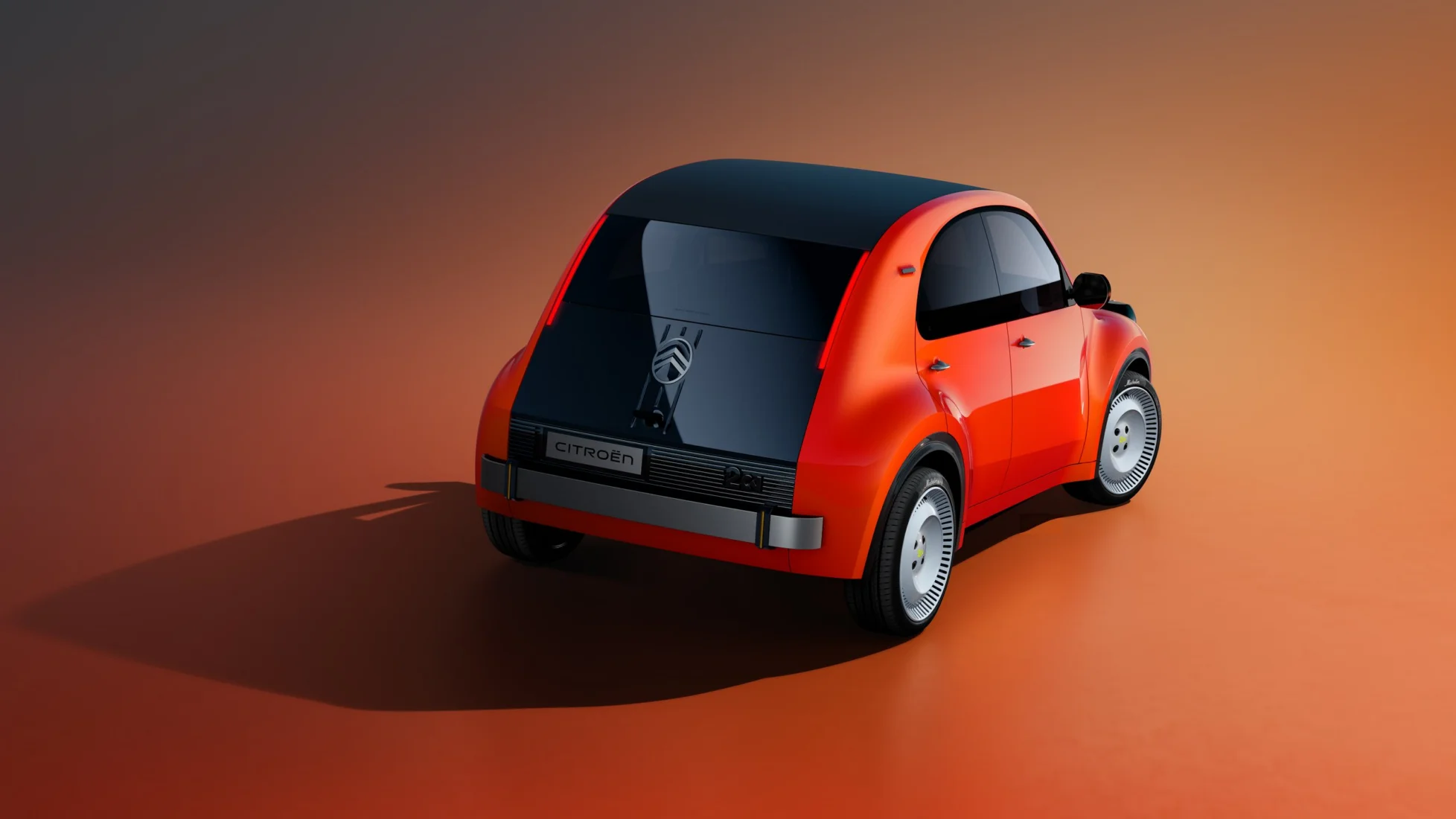 Fütüristik ve aerodinamik hatlara sahip parlak beyaz bir Citroën konsept otomobil, geniş ön camı, belirgin çamurlukları ve yenilikçi far tasarımıyla, muhtemelen Paris Otomobil Fuarı gibi uluslararası bir etkinlikte sergilenerek otomotiv dünyasının geleceğine dair çarpıcı bir vizyon sunuyor.