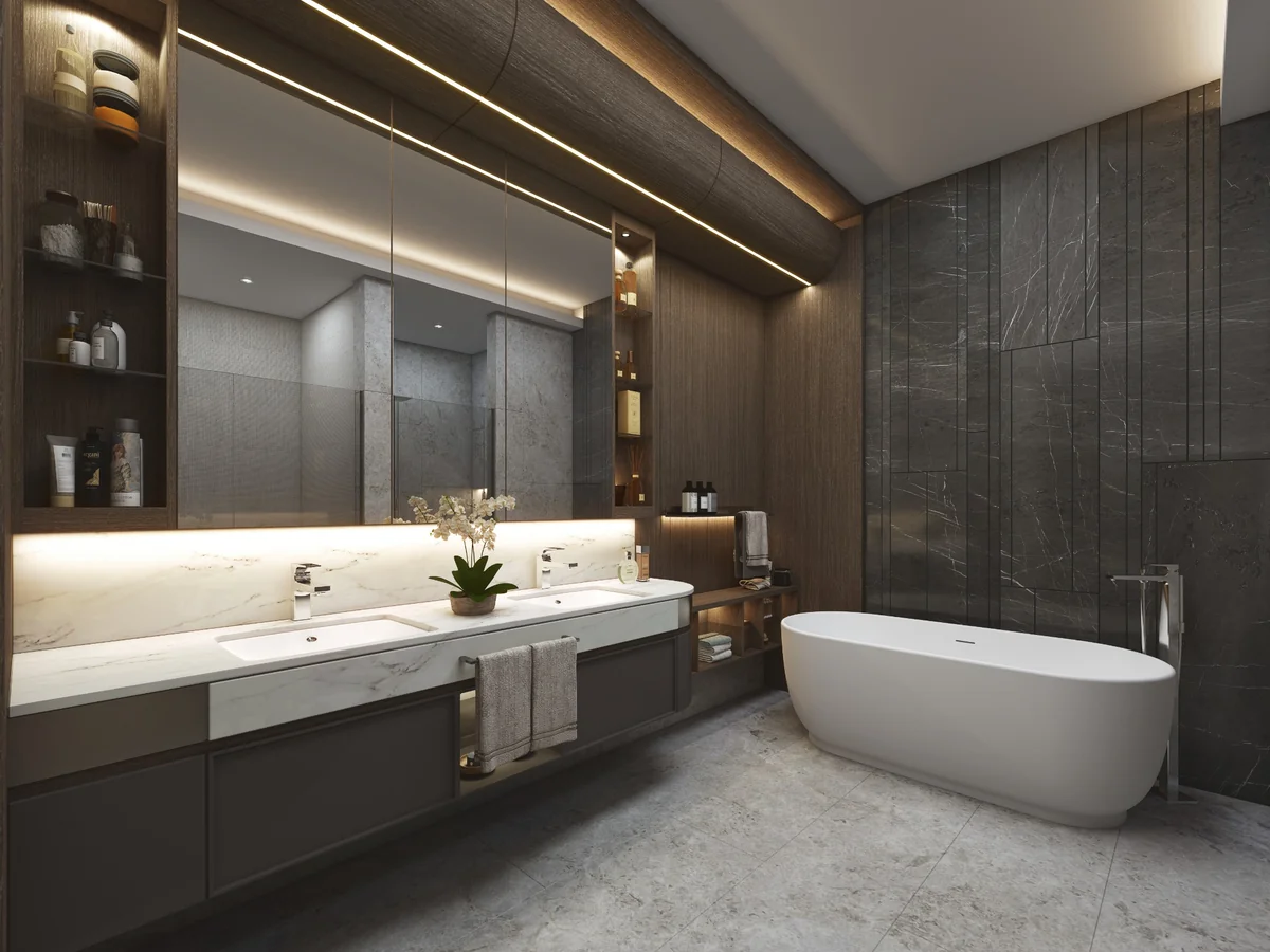 NİVAK Florya’da banyo tasarımına ait koyu doğal taş yüzeyler, ahşap dolaplar, çift lavabo ve bağımsız küvet.